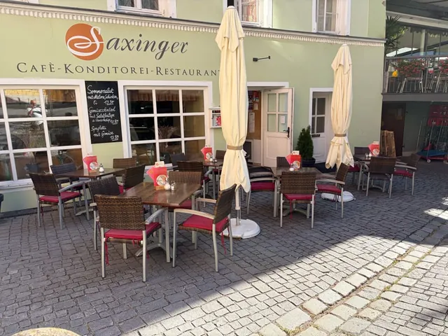 Our building on Kirchplatz with the Saxinger lettering and the terrace in front