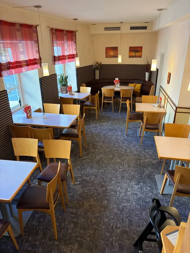 Tables by the windows overlooking Kirchplatz